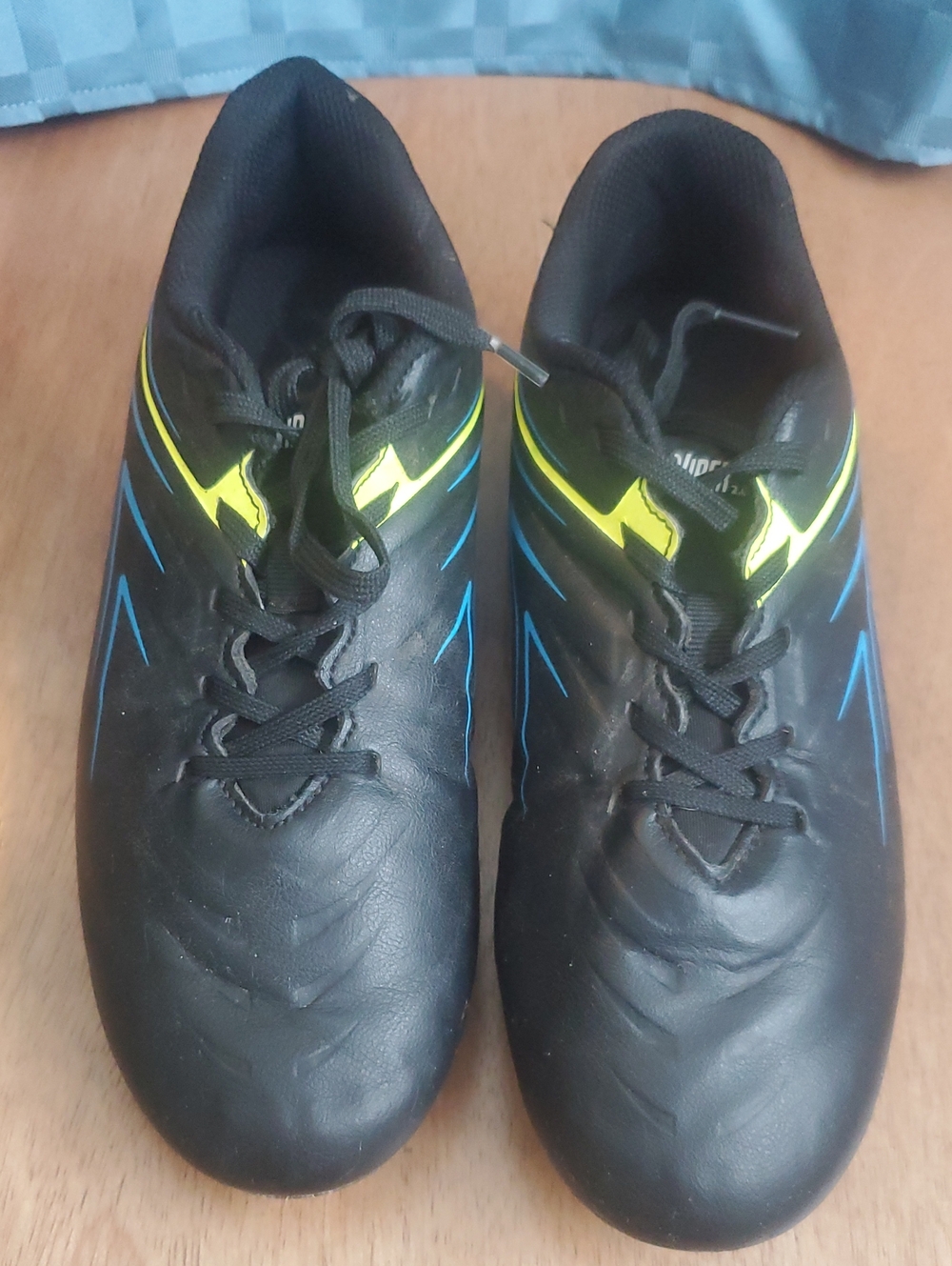 Boys Black Athletic Soccer Shoes with Yellow Accents